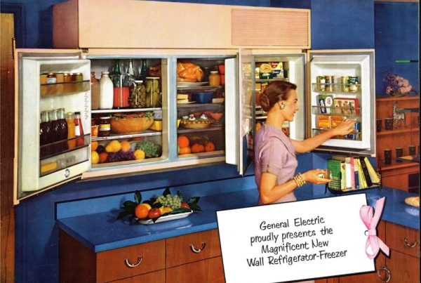 Advertisement for a cabinet fridge showing a woman with mid-century modern style cabinet refrigerator.