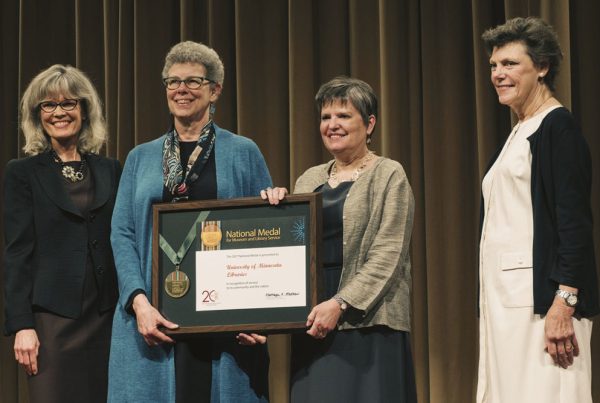 Wendy Lougee and Jennifer Gunn accept the National Medal for Museum and Library Service. At far left is Dr. Kathryn K. Matthew, director of the Institute of Museum and Library Services. At far right is Cokie Roberts, Journalist and Commentator for National Public Radio and ABC News.