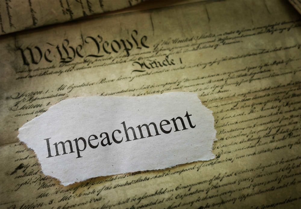 The word Impeachment superimposed over the Constitution.