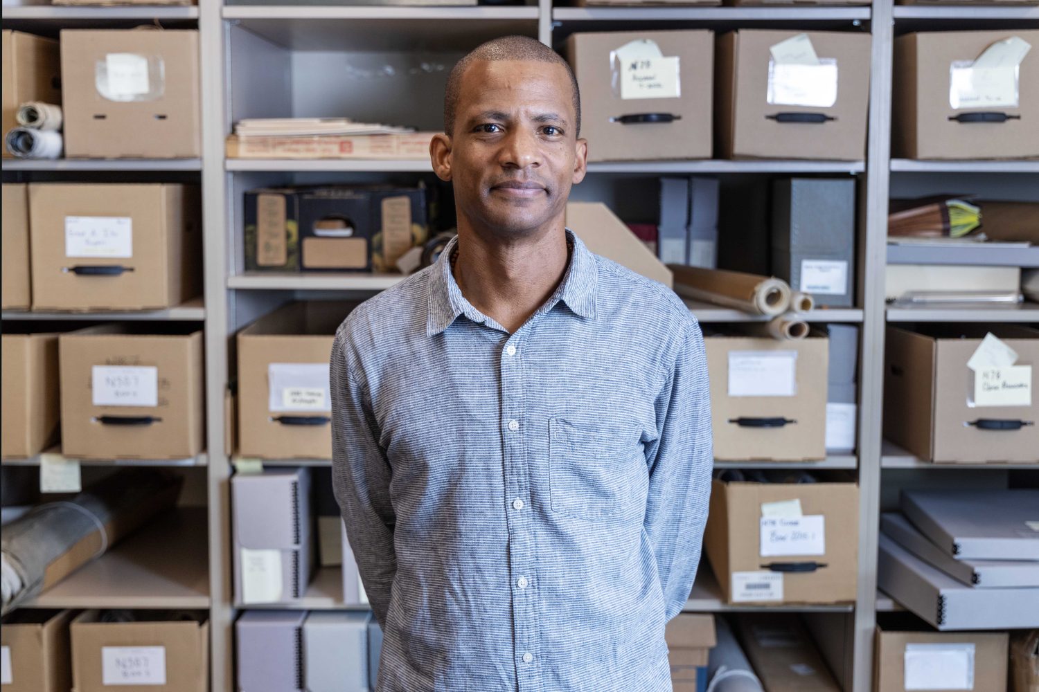 Davu Seru, the new curator of the Givens Collection of African American Literature, poses for a portrait in Elmer L. Andersen Library, on Tuesday, Sept. 5, 2023. (Photo/Adria Carpenter)