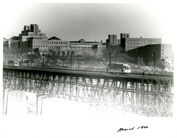 Coffman Union. Mpls. Campus. View from Wash. Ave. Bridge w_ Trolley Cars.