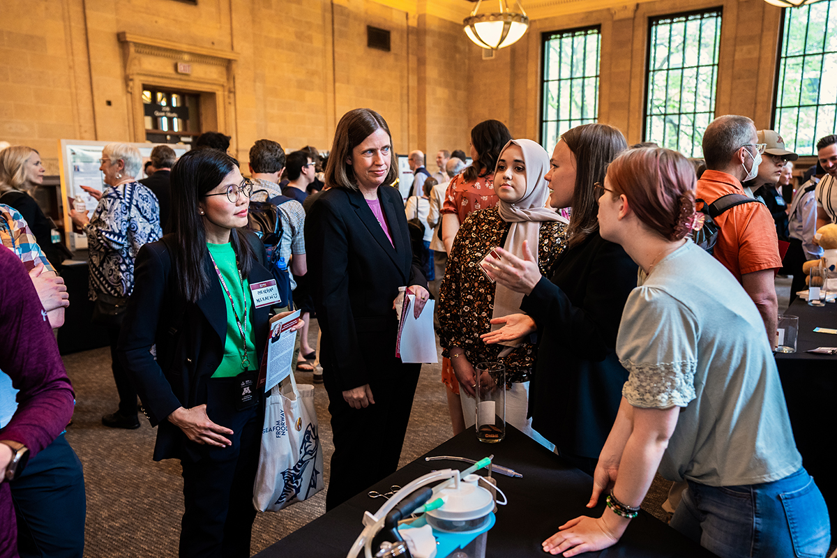 Students present their prototype demo at Founders Day 2023 to attendees at Walter Library