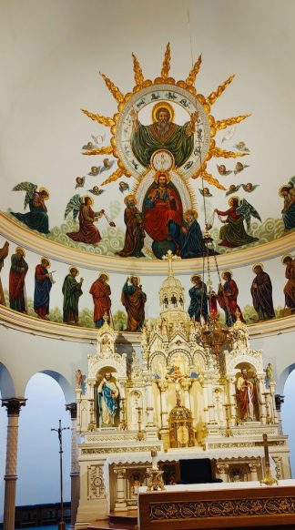Altar artwork with three parts of the Holy Trinity, with a white background