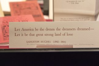 Card showing Langston Hughes quote, “Let American be the dream the dreamers dreamed — Let it be that great strong land of love”