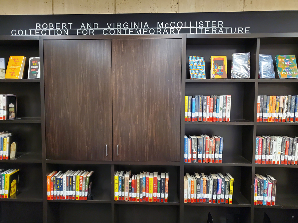 Bookshelves with books on display as part of the McCollister Collection for Contemporary Literature at Wilson Library