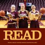 Three Gopher Women's basketball players holding books and basketballs at center court at Williams Arena.
