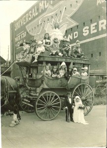Children playing on a horse drawn coach made up to be Cinderella's coach.