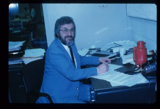 Bill DeJohn at his desk during his first year as Minitex Director in Wilson Library.