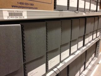 Picture of hollinger boxes on shelves showing the processed Heino Taremäe Papers.
