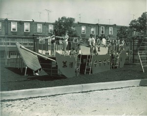 A photo showing children on a playground created to look like a pirate ship.