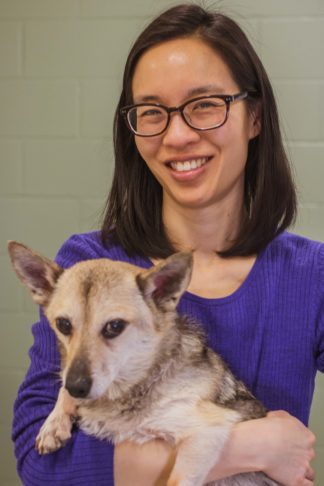 Rosalind Chow holding her dog