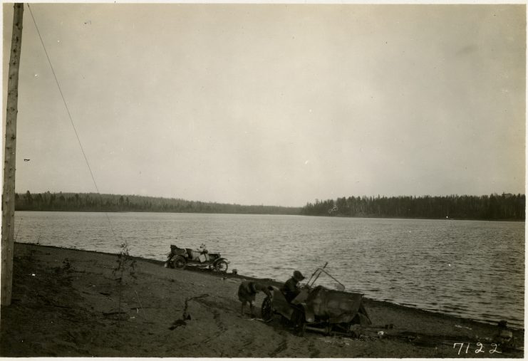 Automobiles driven to the shore of Moose Lake, Minnesota. Photographer: T.J. Horton.