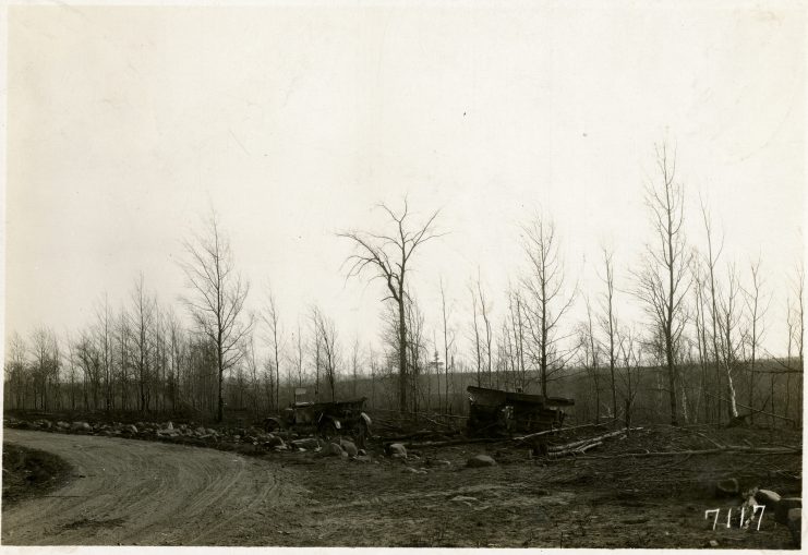 Wrecked automobiles and the site of multiple fatalities south of Kettle River, Minnesota. Photographer: T.J. Horton.