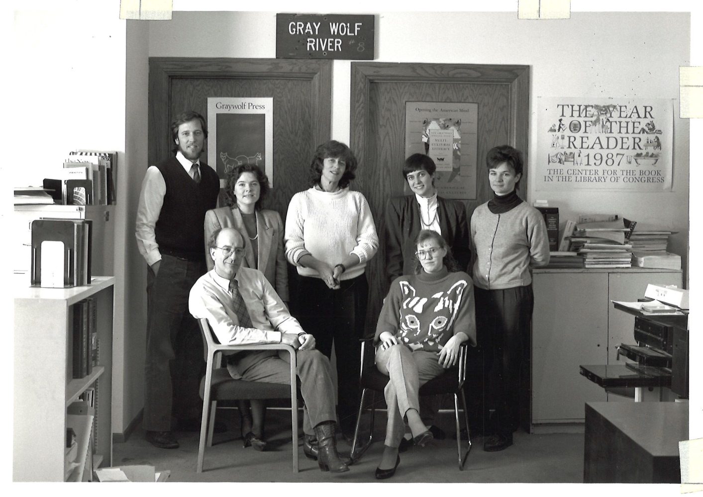 Graywolf Press staff in their St. Paul office. Standing from left to right: Scott Walker, Sheila Murphy, Pat Davis, Cathe Nelson, Ellen Foos. Seated from left to right: Paul Schultz and Elizabeth Gjere.