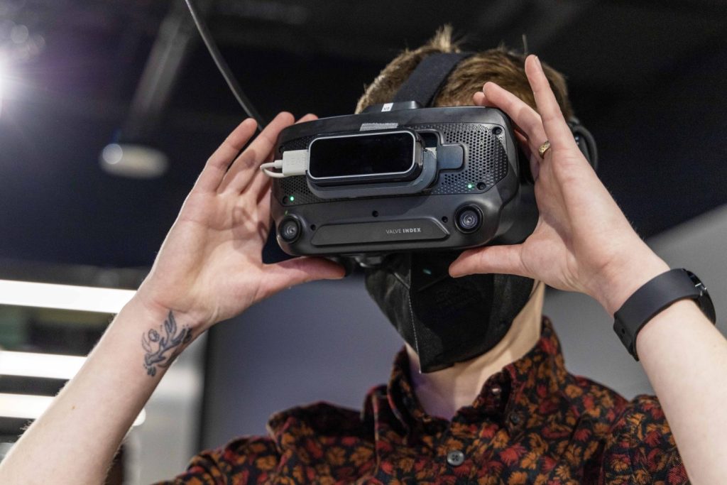 Ryn Gagen, Assistant Librarian at the Health Sciences Library and a liaison to the Medical School. sets up the Embodied Labs app in the Virtual Reality Studio to learn about dementia and Alzheimer's disease, on Friday, January 5, 2024. (Photo/Adria Carpenter)