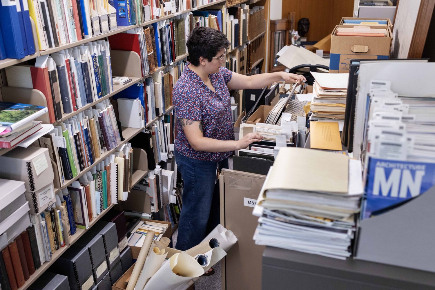 Erin McBrien, curator of the Upper Midwest Literary Archives, poses for a portrait in Andersen Library, on Friday, July 5, 2024. (Photo/Adria Carpenter)