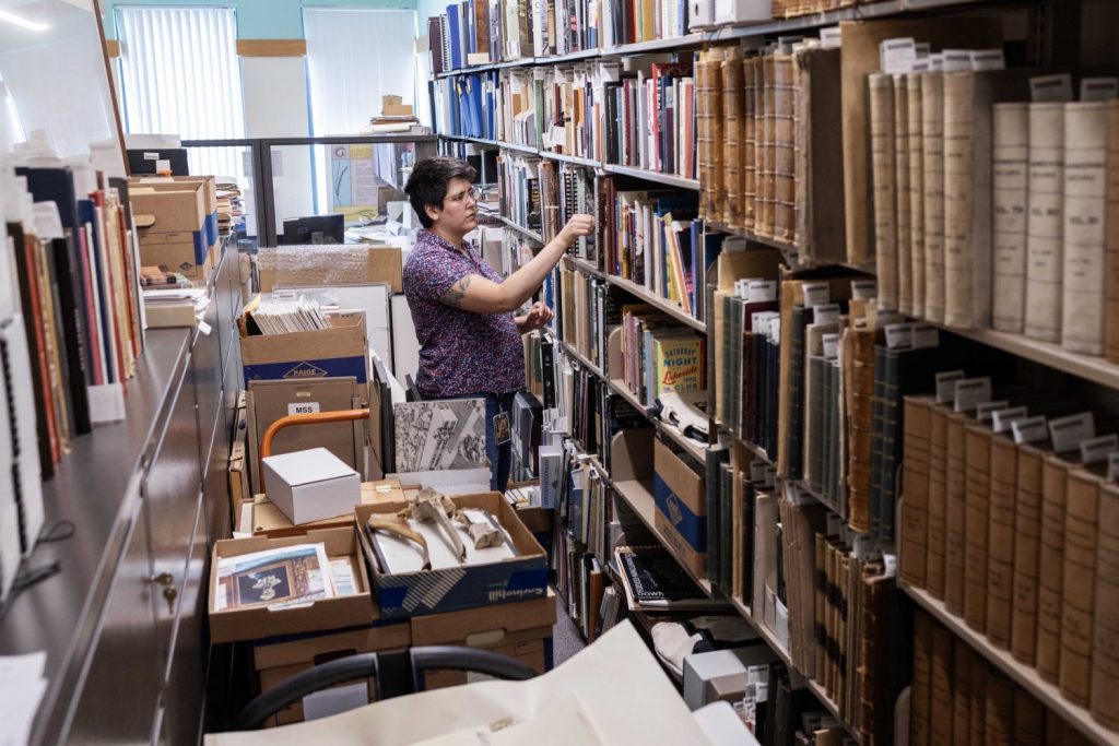 Erin McBrien, curator of the Upper Midwest Literary Archives, poses for a portrait in Andersen Library, on Friday, July 5, 2024. (Photo/Adria Carpenter)