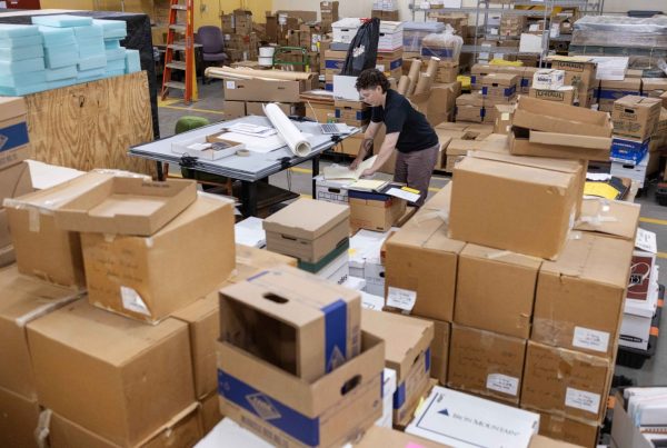 Lisa Janette, head of archival processing at the University of Minnesota Libraries, works through the accessioning process of materials for the Performing Arts Archives, on Monday, July 15, 2024, in the Archives and Special Collections. (Photo/Adria Carpenter)