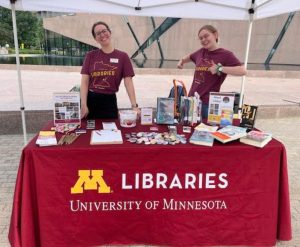 Two staff at the Libraries table.