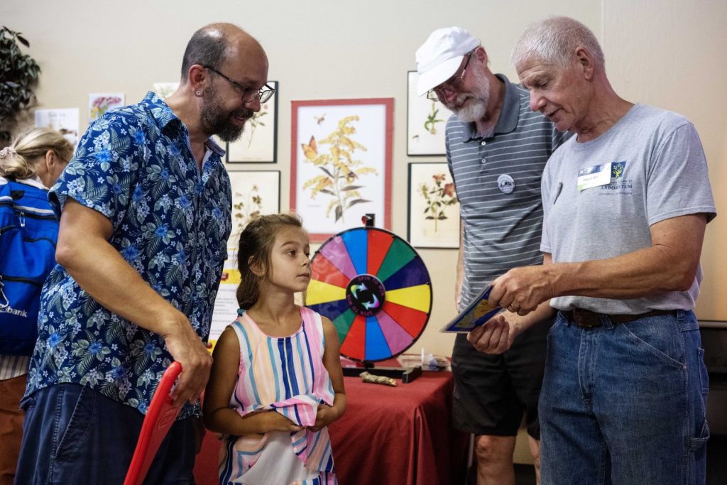 Volunteers at the Andersen Horticultural Library booth ask trivia questions at the Minnesota State Fair on Thursday, August 29, 2024. (Photo/Adria Carpenter)