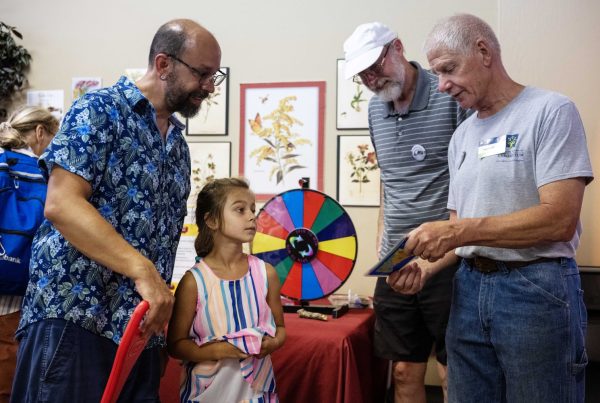 Volunteers at the Andersen Horticultural Library booth ask trivia questions at the Minnesota State Fair on Thursday, August 29, 2024. (Photo/Adria Carpenter)