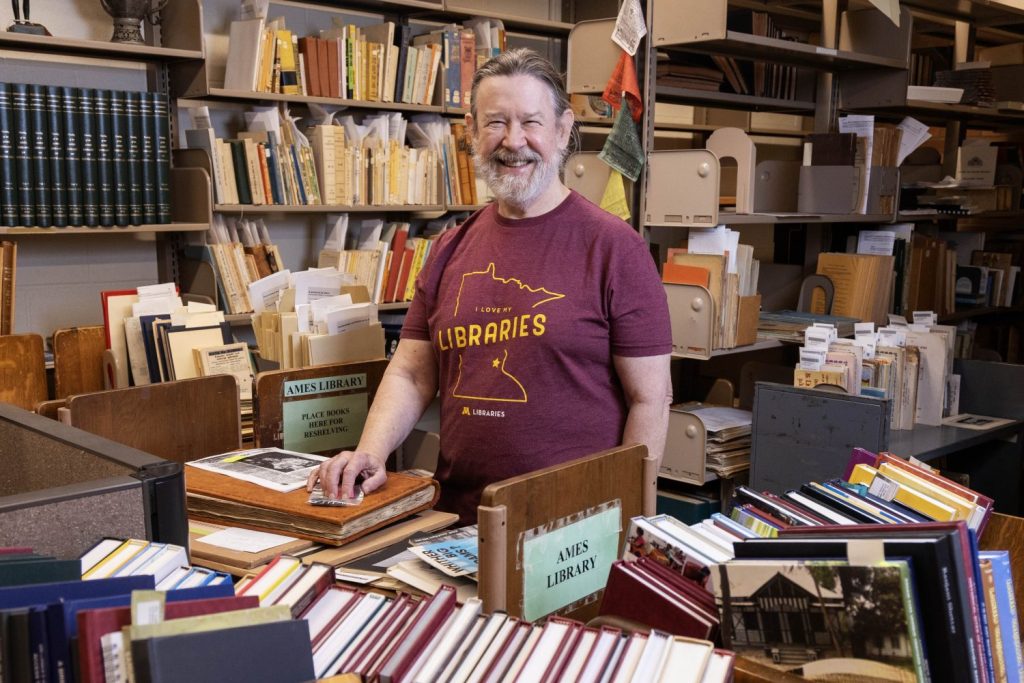 David Faust, the South Asia and Middle East Librarian, poses for a portrait in his office in Wilson Library on Wednesday, September 4, 2024. Faust is retiring from the Libraries this month. (Photo/Adria Carpenter)