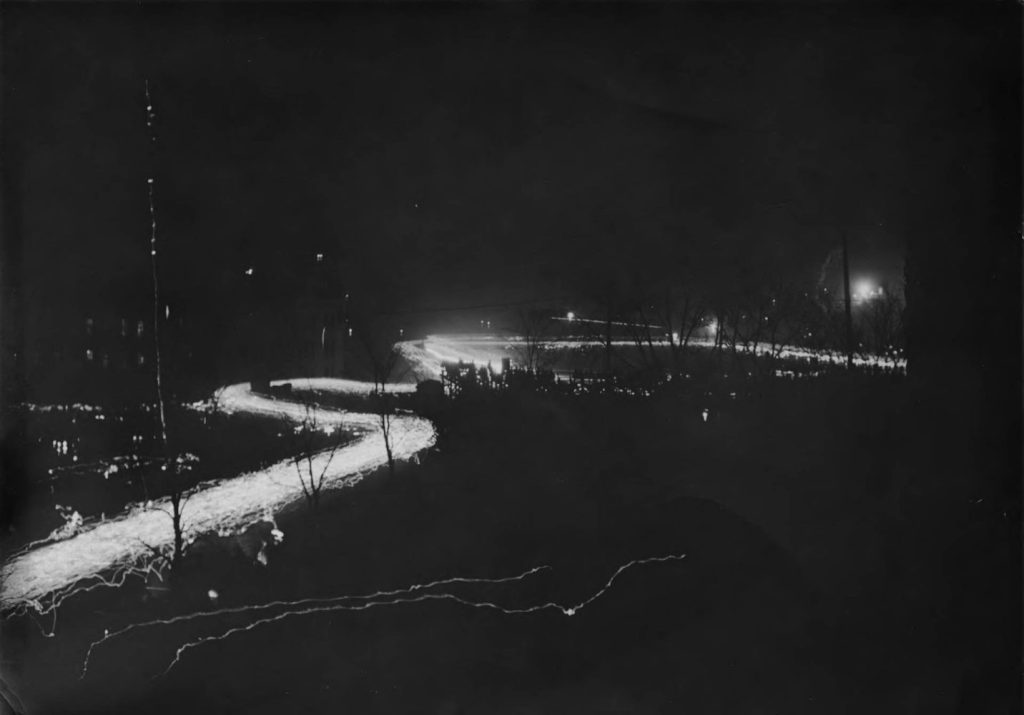 An estimated 8,000 faculty, staff, students, and alumni participated in a torch parade into Northrop Field Stadium for the inauguration of President George Edgar Vincent, October 17, 1911. University of Minnesota Archives Photograph Collection, https://umedia.lib.umn.edu/item/p16022coll175:1661.