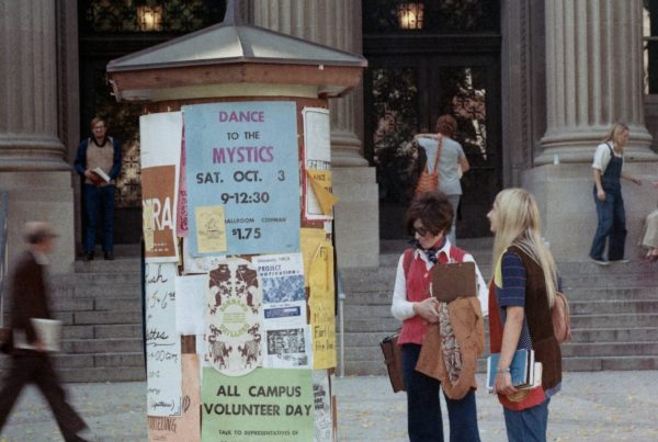 Kiosk in front of Walter Library covered in posters, 1970