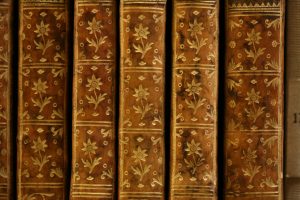 Book spines imprinted with a floral pattern