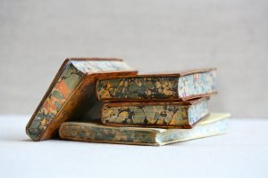 Stack of books with marbled paper