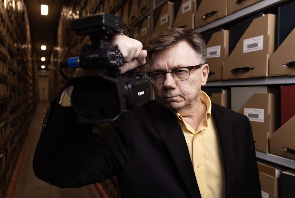 Mark Engebretson, the University of Minnesota Libraries' director of advancement, poses for a portrait in Elmer L. Andersen Library on Tuesday, February 4, 2024. Engebretson is retiring after 26 years at the University. (Photo/Adria Carpenter)