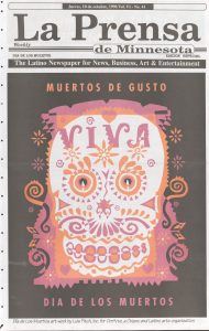 The front page of an October 1996 newspaper showing a pink, white and orange Día de los Muerto skeletal head on a black background.