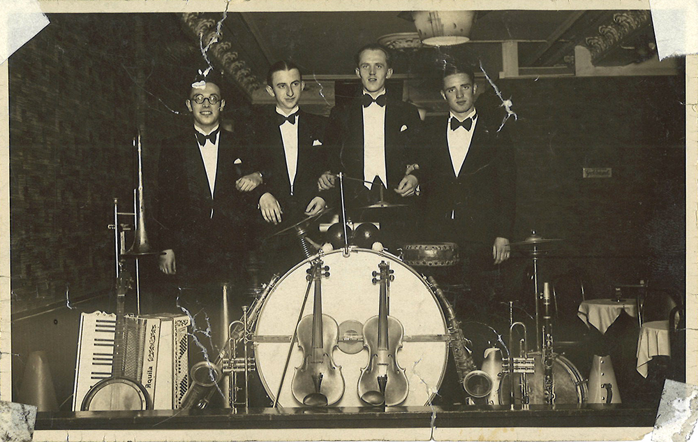 Young Werner Simon poses with three bandmates and musical instruments