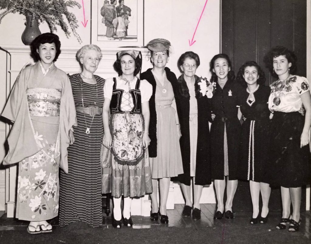 eight women standing in an office in 1946 in San Francisco International Institute