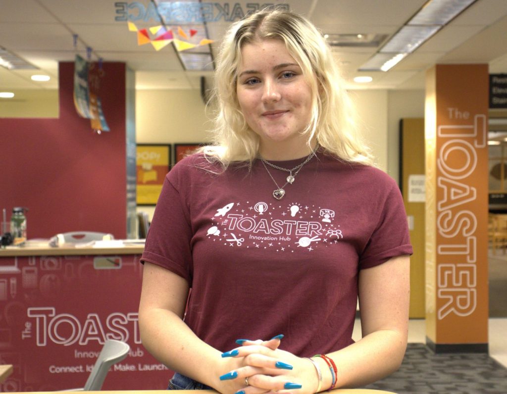 Megan Davis is standing in the Toaster Innovation Hub.