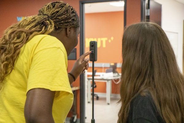 Two 4-H participants recording video with a 360 degree camera