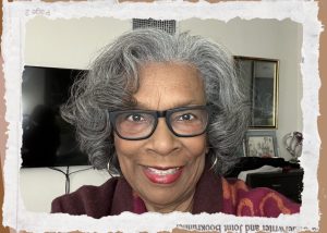 Headshot of Mary Moore Easter wearing glasses and smiling